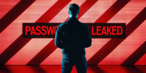 Man standing in front of red password leaked sign